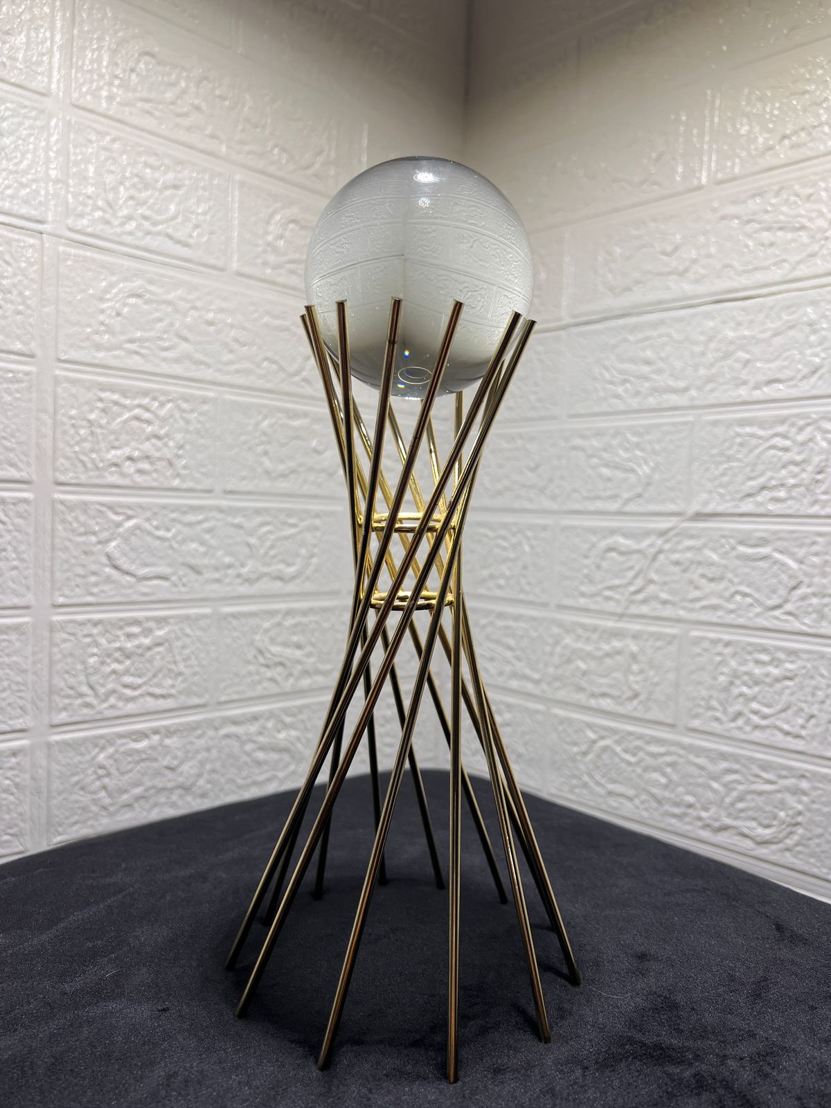 Crystal sphere with twisted gold stand