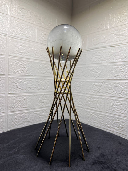 Crystal sphere with twisted gold stand